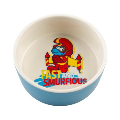 Duvoplus – Mangeoire Schtroumpfs Jetpack en céramique pour chien et chat, idéale pour servir nourriture et eau avec une touche ludique – 500ml – 15x15x6cm – Blanc/Bleu